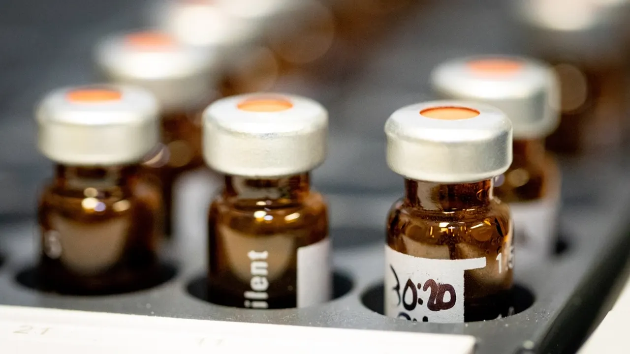 Close-up of glass medicine vials in a lab