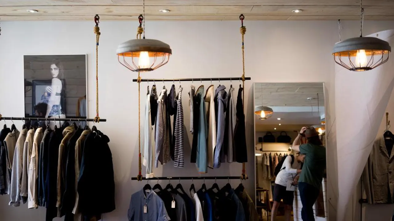 Clothing boutique interior with pendant lights