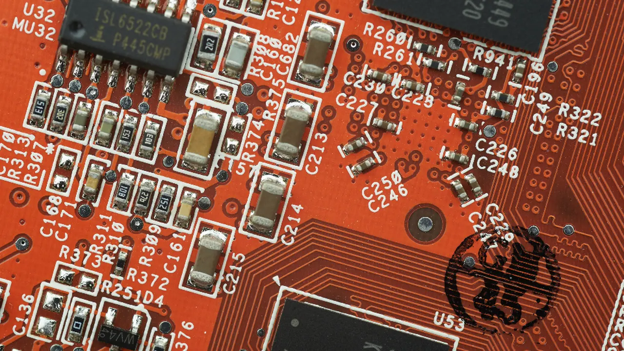 Close-up of an orange circuit board with components