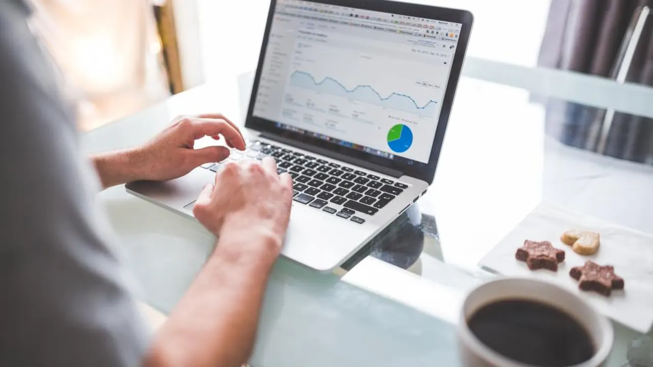 Laptop showing an analytics dashboard on a desk