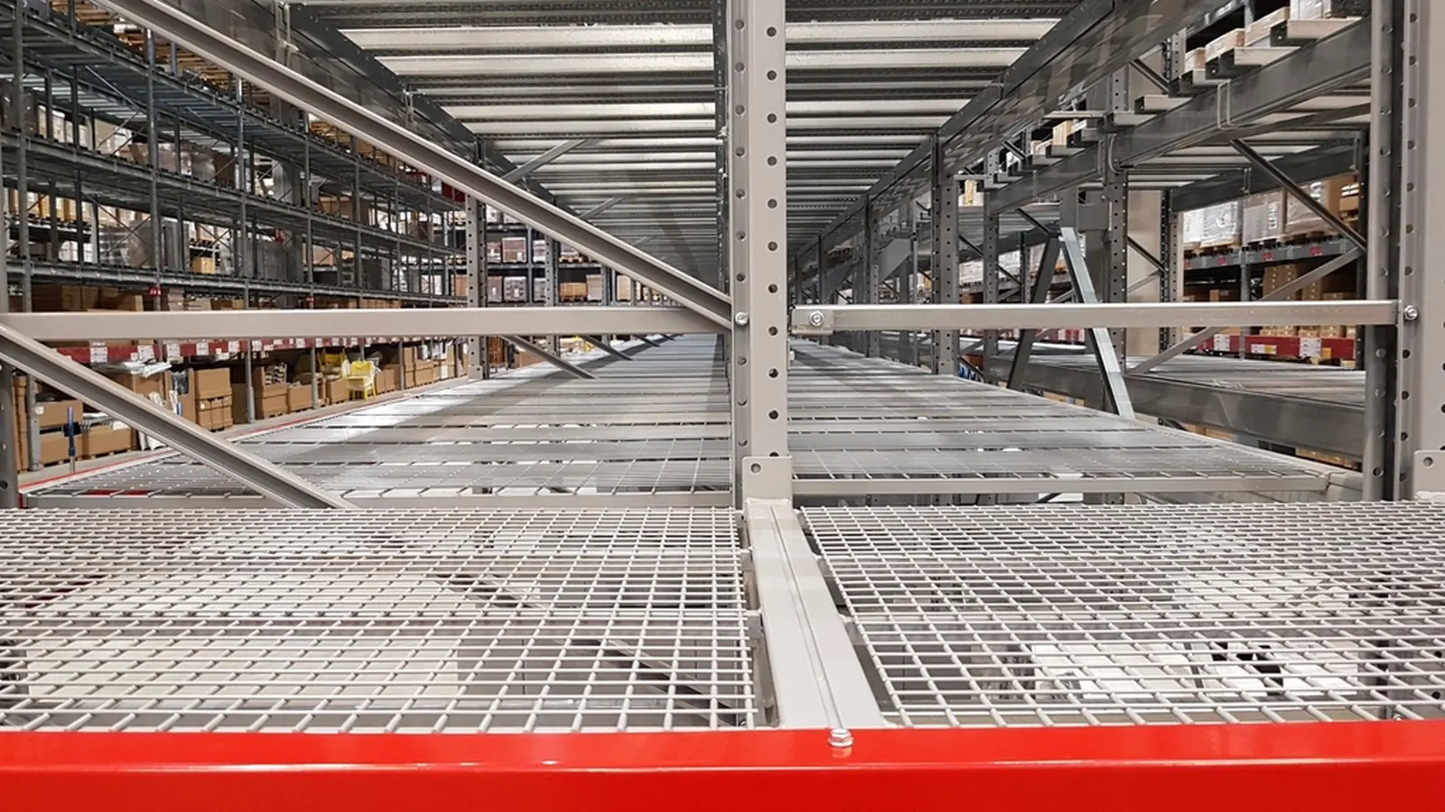 Rows of warehouse racking seen from below